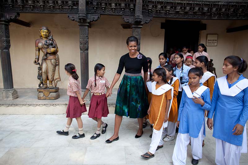 First Lady Michelle Obama, accompanied by children